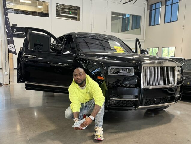 A Rolls-Royce Cullinan valued at over ₦700 million is currently undergoing maintenance by a roadside mechanic in Nigeria.