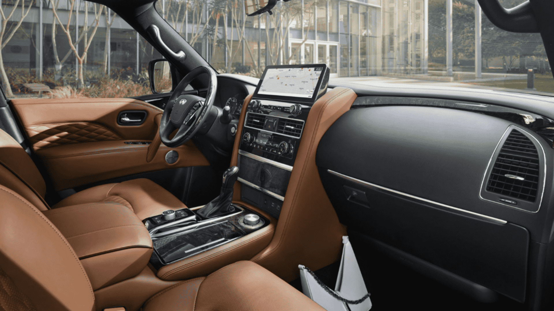 The Interior, Steering, And Central Console Of A 2025 Infiniti QX80