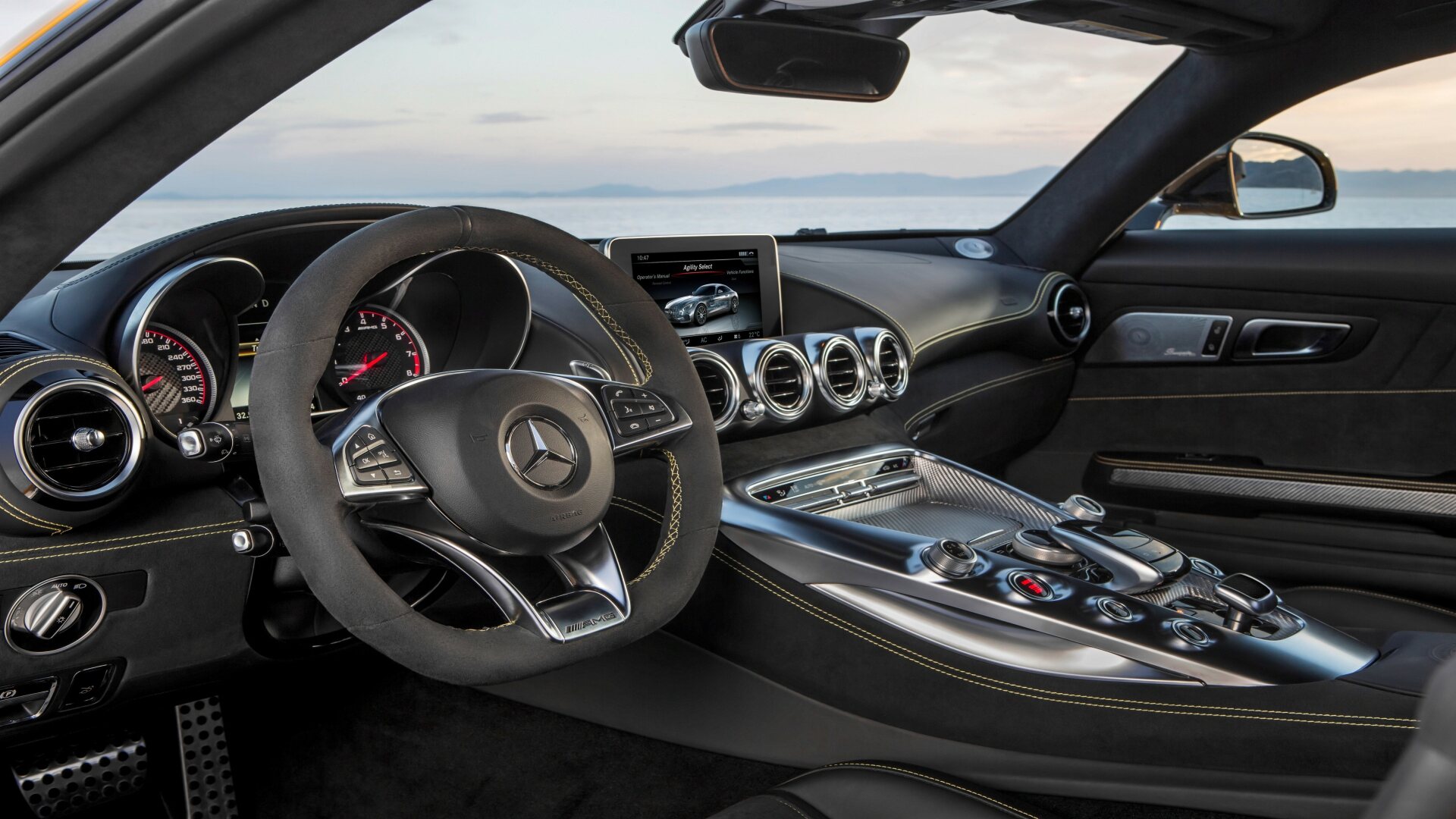 The Interior, Steering, And Central Console Of A Mercedes-AMG GT