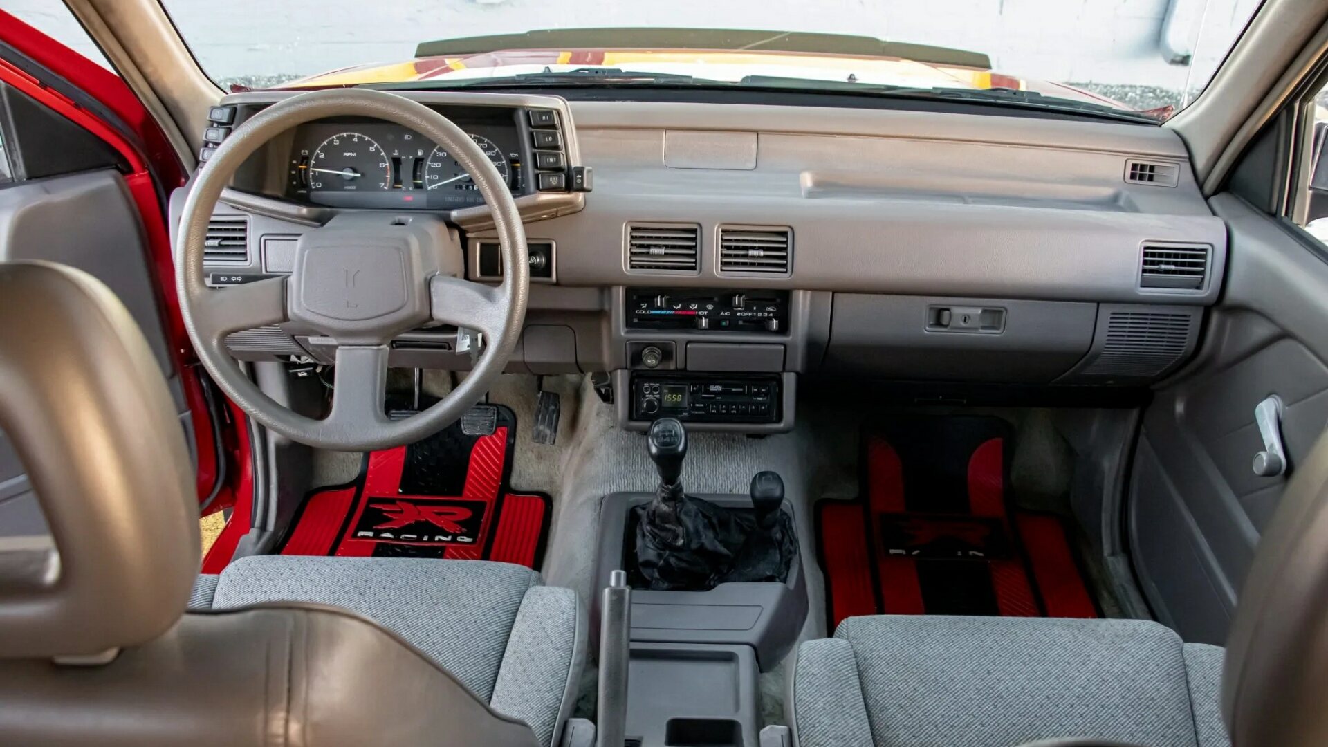 The Interior, Steering, And Dashboard Of The 1994 Isuzu Amigo XS 4WD That Is On Auction