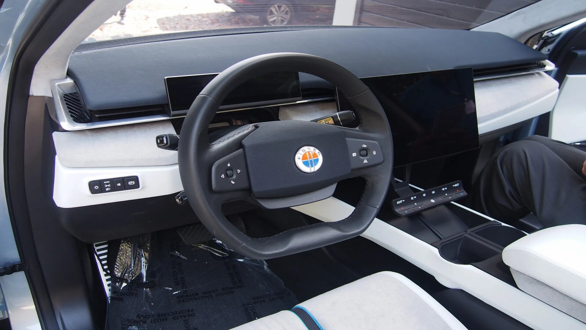 The Interior, Steering, Dashboard, And Central Console Of A 2023 Fisker Ocean SUV