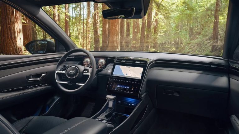 The Interior, Steering, Dashboard, And Central Console Of A 2024 Hyundai Santa Cruz
