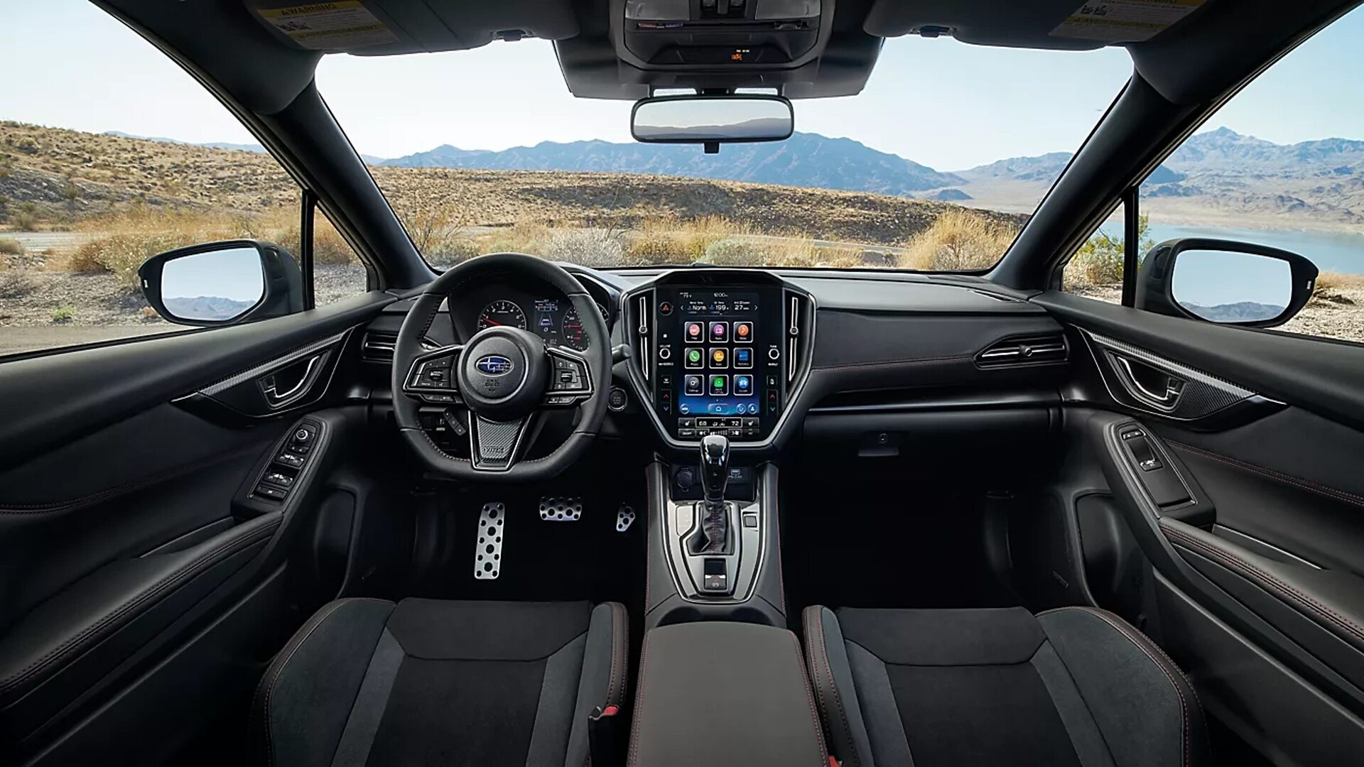 The Interior, Steering, Dashboard, And Central Console Of A 2024 Subaru WRX