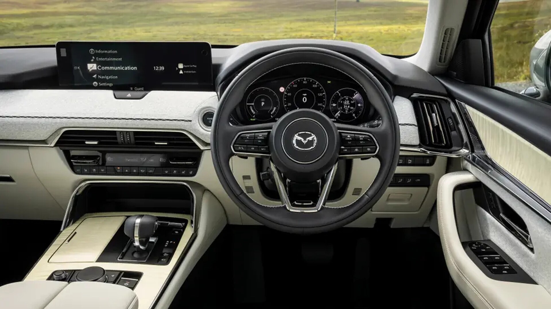 The Interior, Steering, Dashboard, And Central Console Of A Mazda CX-60