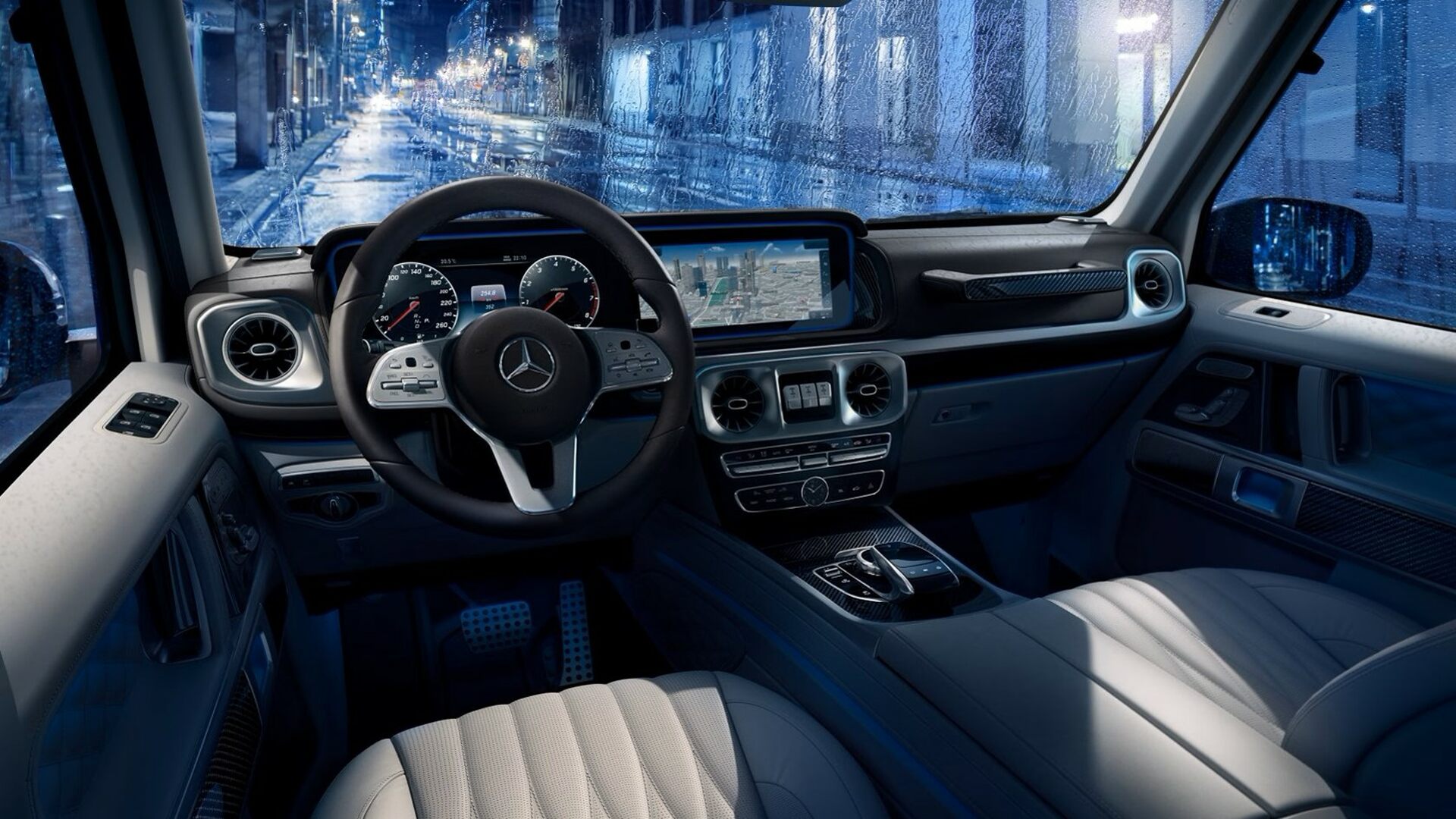 The Interior, Steering, Dashboard, And Central Console Of A Mercedes-Benz G550