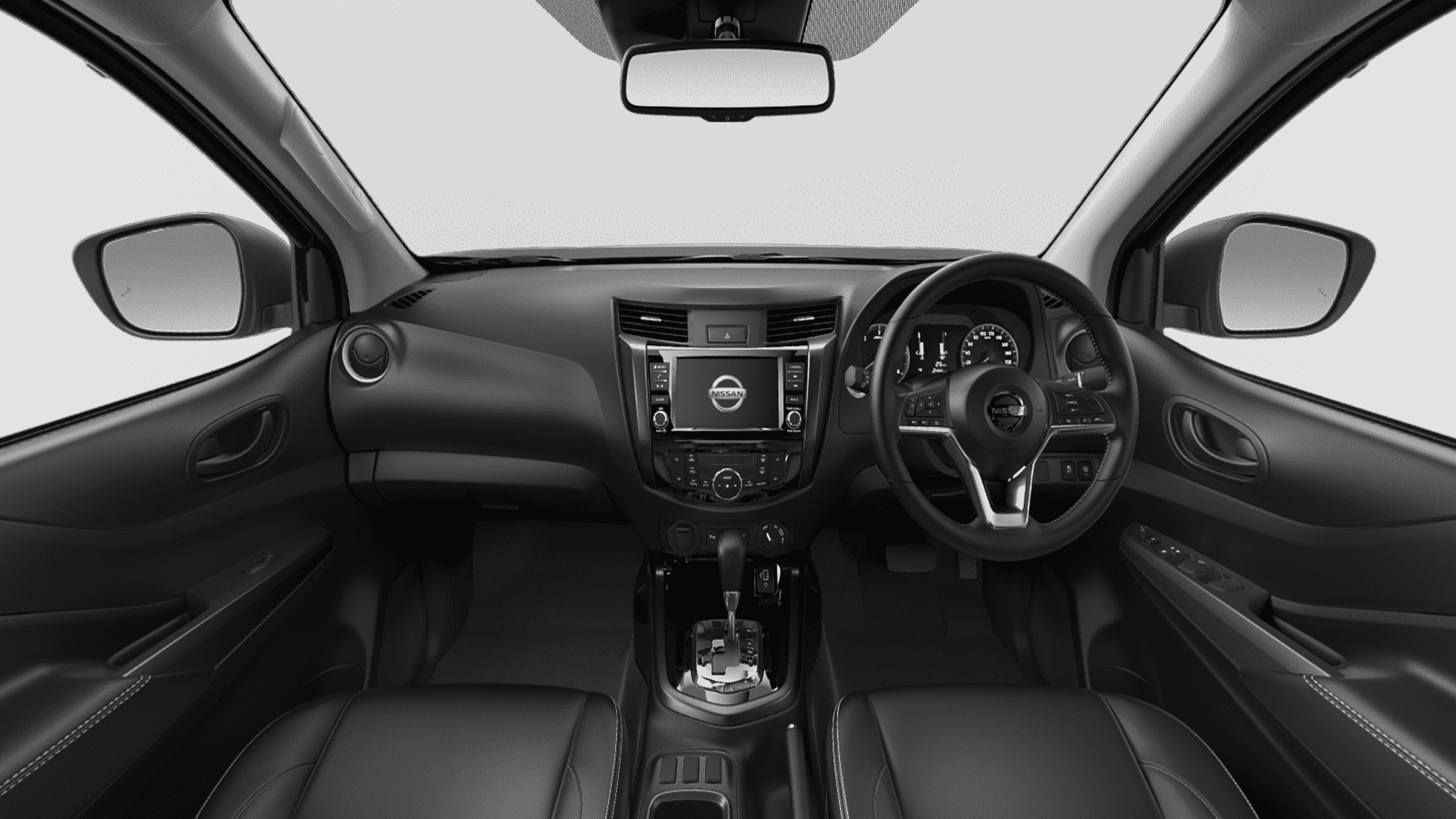 The Interior, Steering, Dashboard, And Central Console Of A Nissan Navara