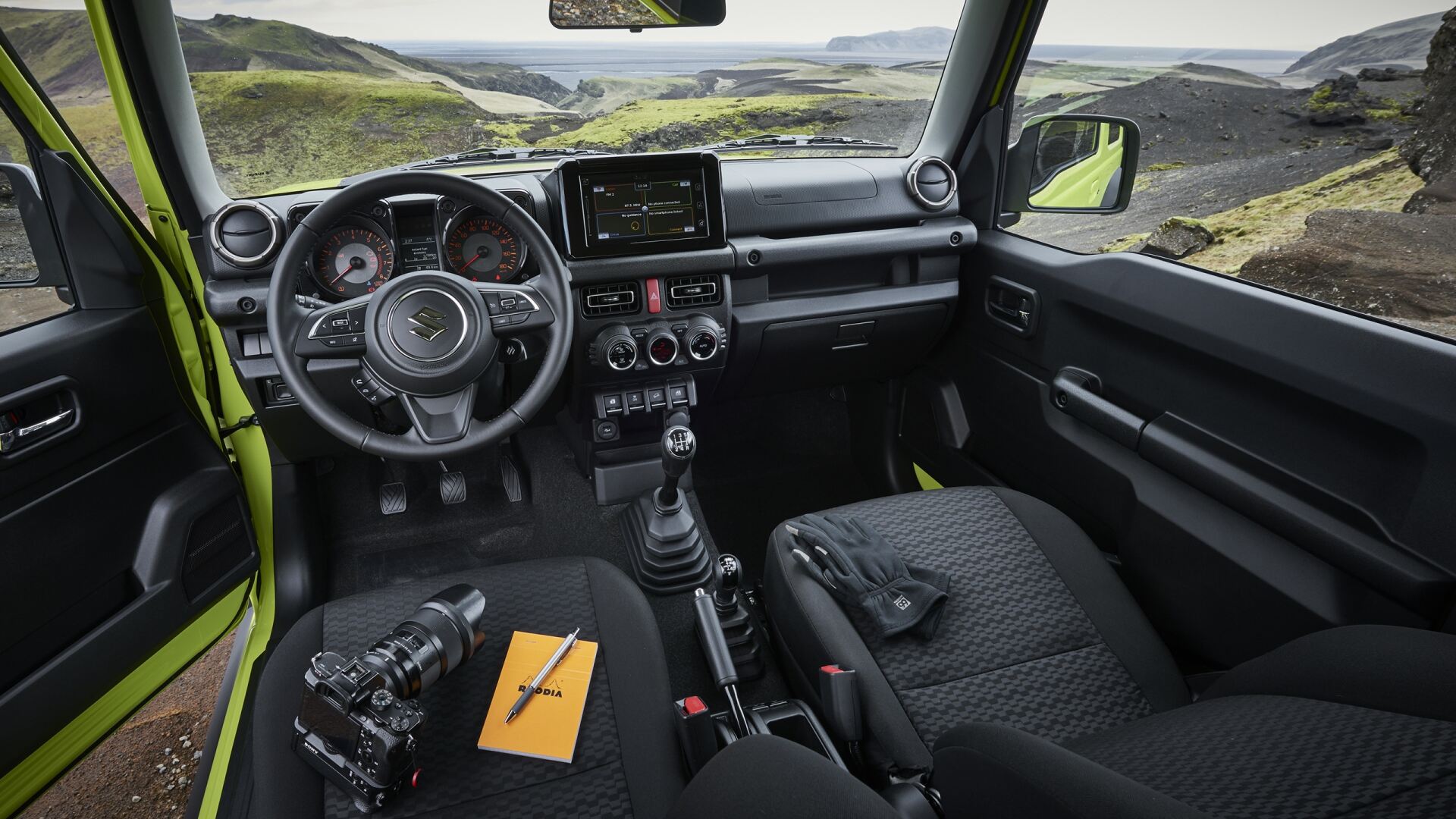 The Interior, Steering, Dashboard, And Central Console Of A Suzuki Jimny (Credits Suzuki)