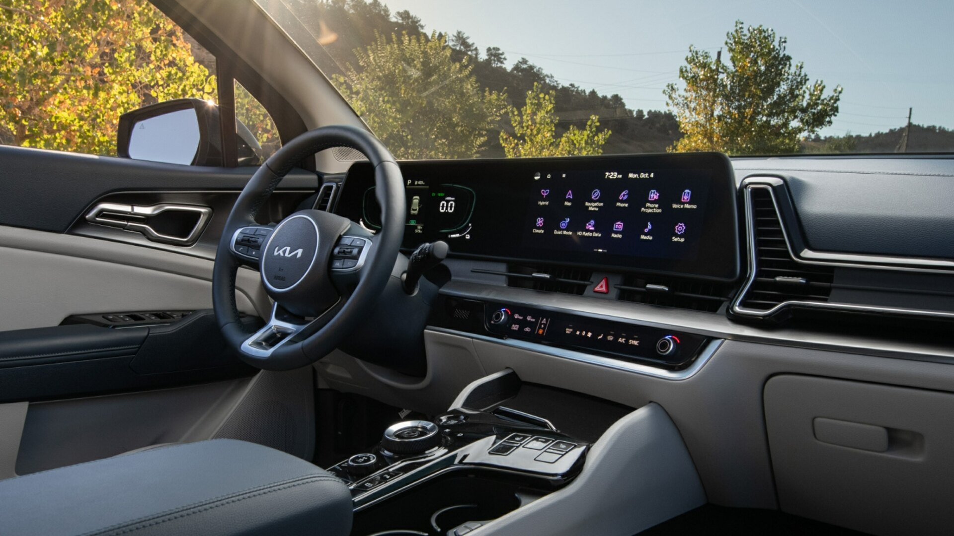 The Steering And Dashboard Of A 2024 Kia Sportage Hybrid