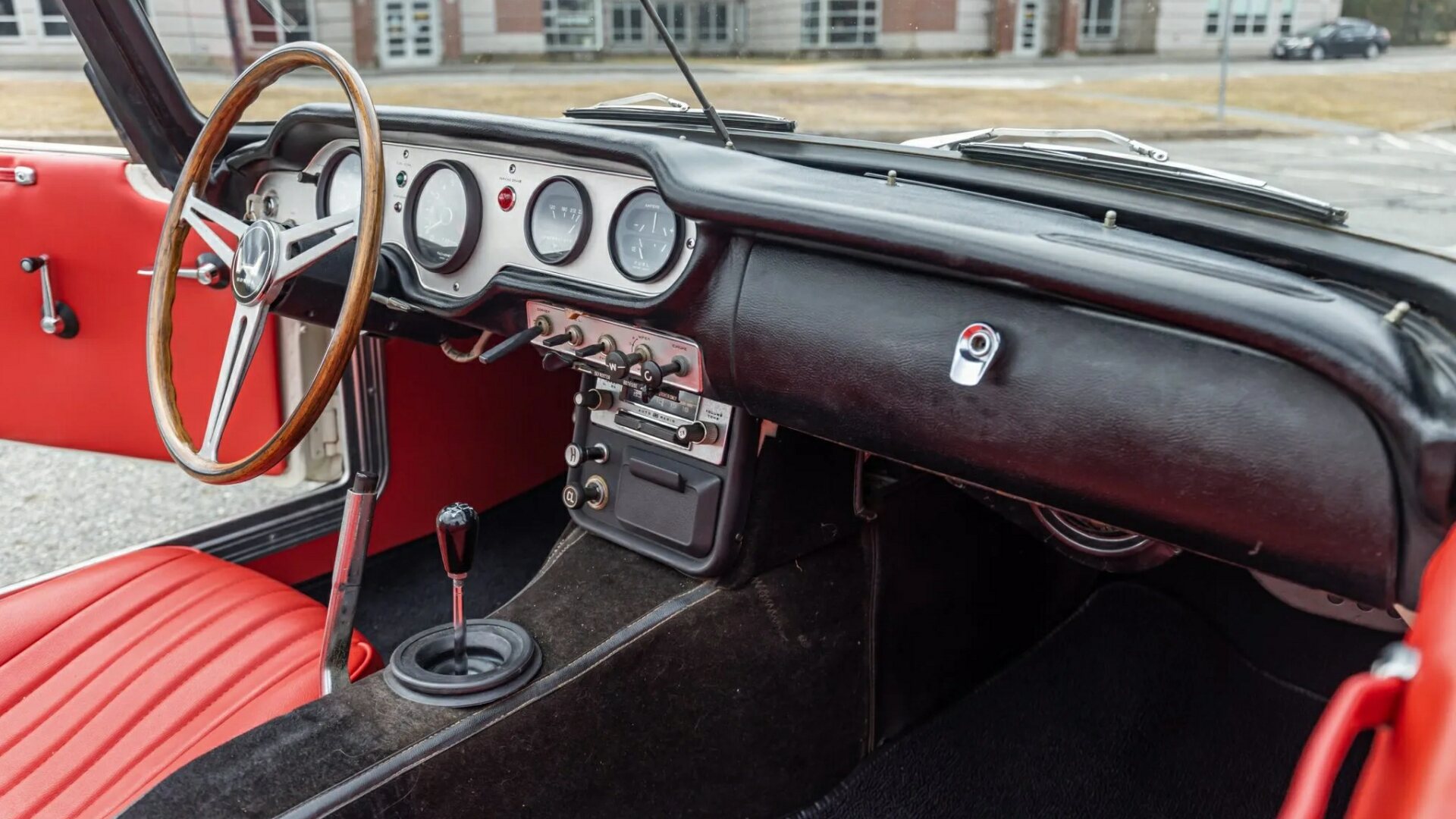 The Steering, Dashboard, And Center Console Of The 1966 Honda S600 Roadster
