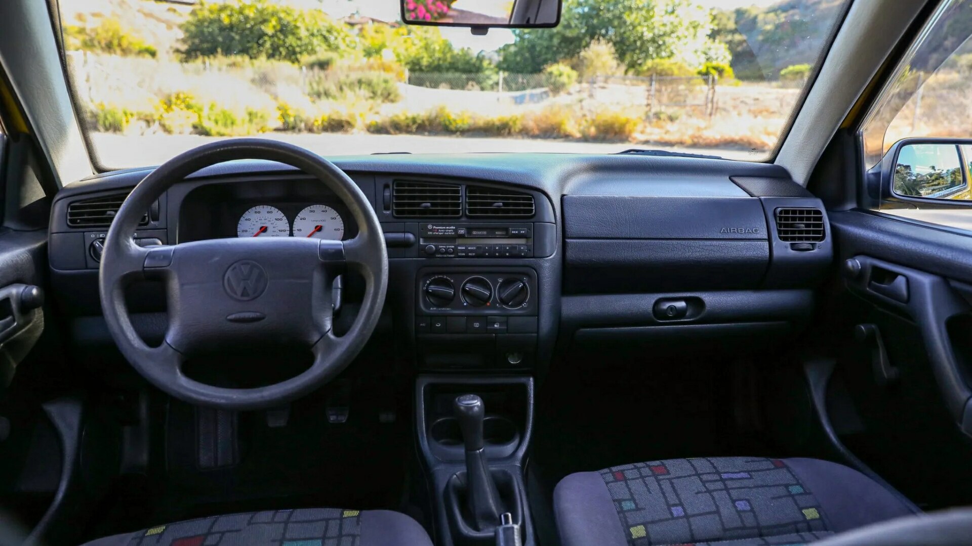 The Interior, Steering And Dashboard Of A 1996 Volkswagen Golf Harlequin (Credits Bring A Trailer)