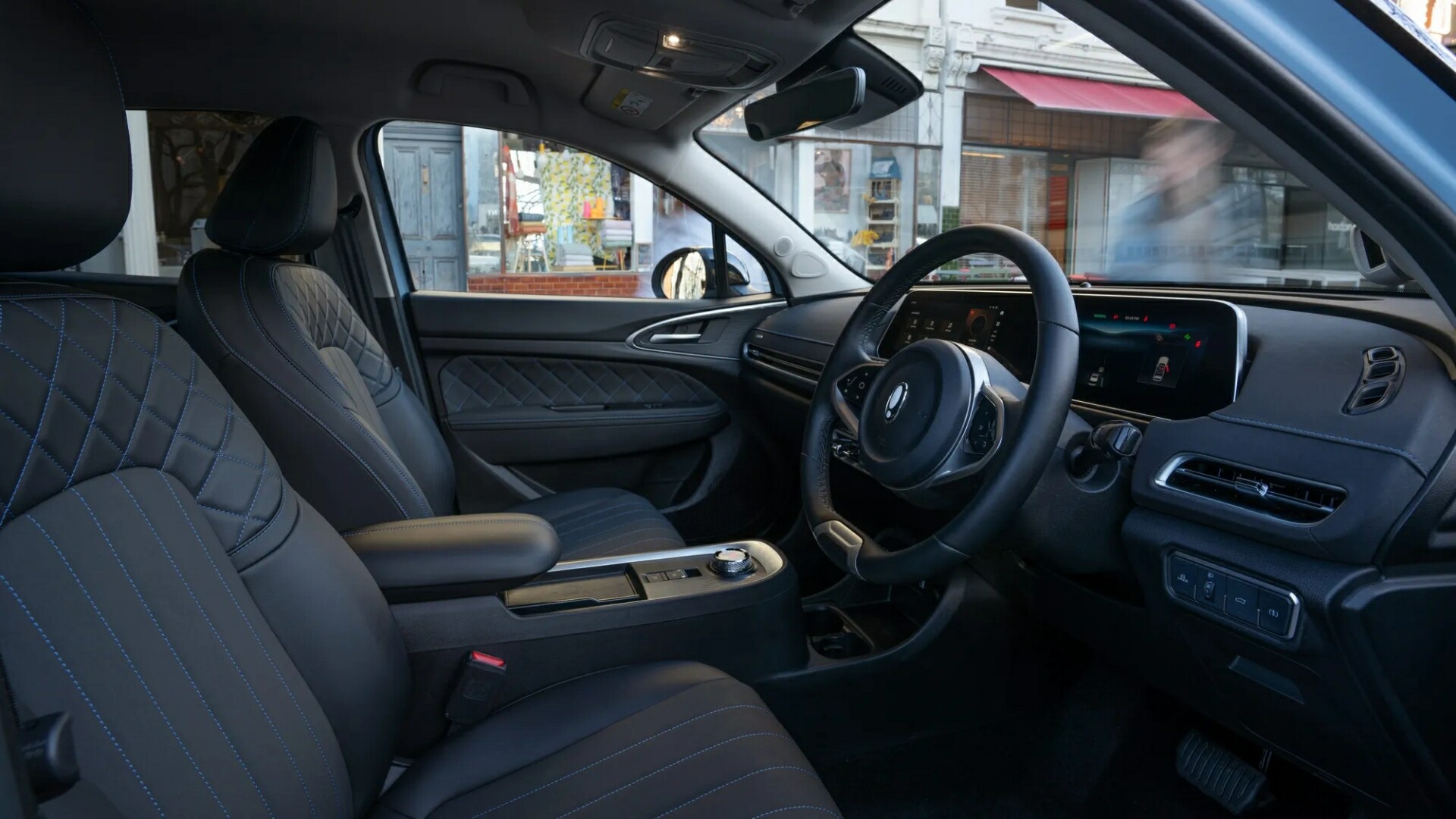 The Interior, Steering, And Dashboard Of A 2024 GWM Ora (Credits GWM)