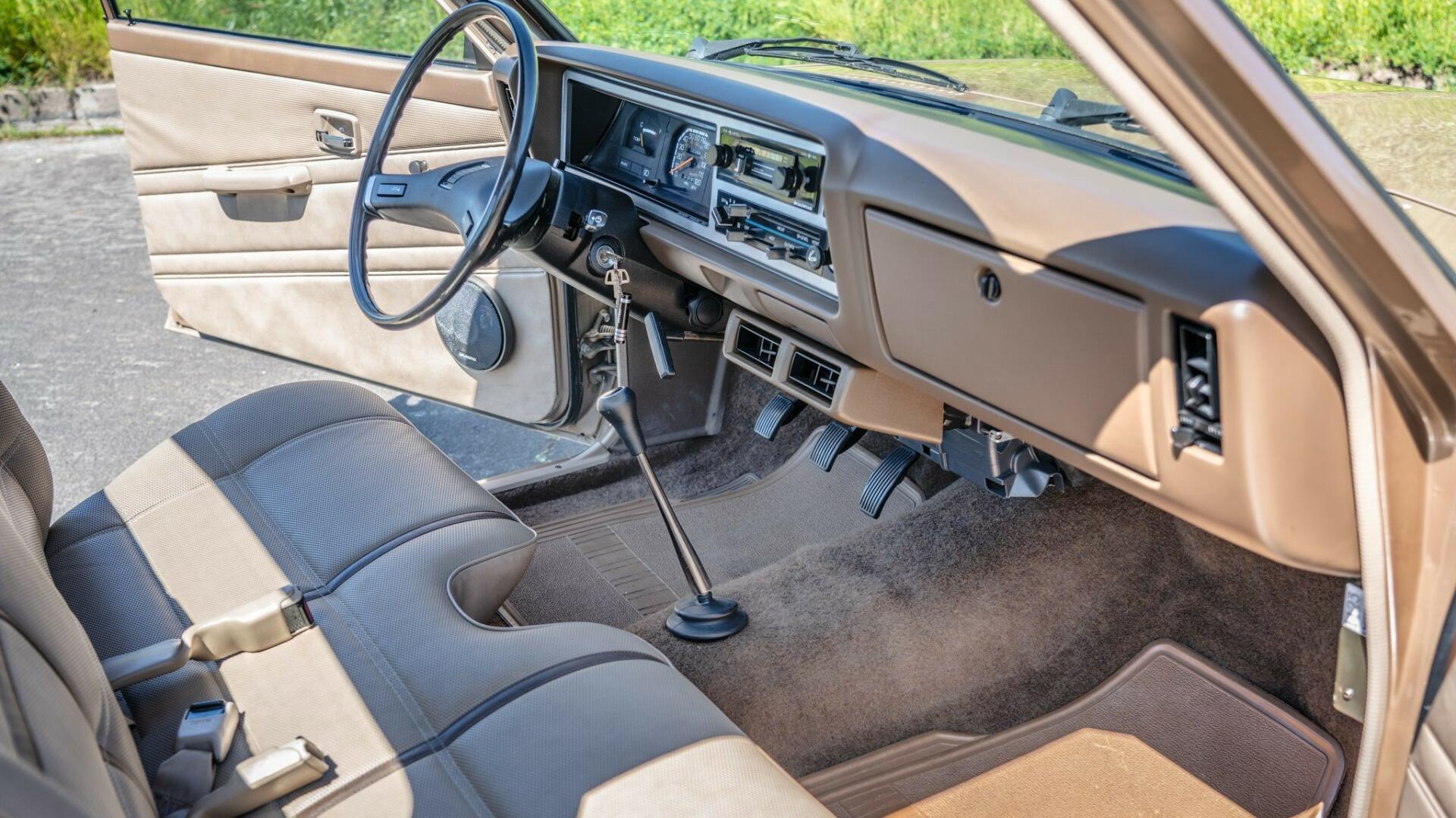 The Interior, Steering, Dashboard, And Central Console Of A 1985 Mitsubishi Mighty Max (Credits Bring a Trailer)