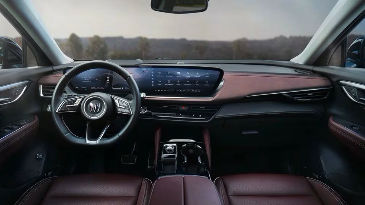The Interior, Steering, Dashboard, And Central Console Of A 2024 Buick Envision