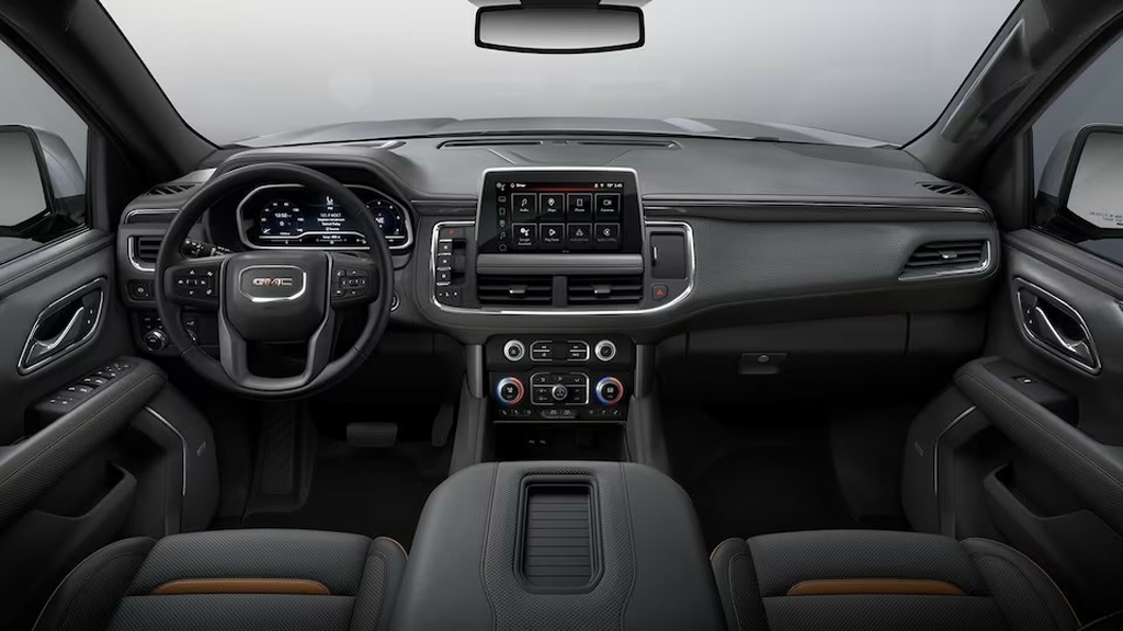 The Interior, Steering, Dashboard, And Central Console Of A 2024 GMC Yukon AT4 (Credits GMC)