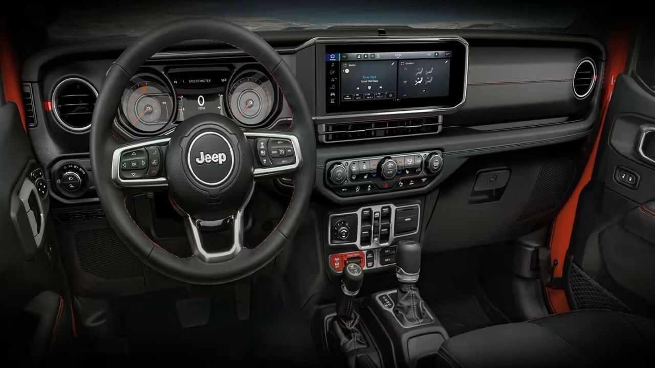 The Interior, Steering, Dashboard, And Central Console Of A 2024 Jeep Gladiator Sport (Credits Jeep)