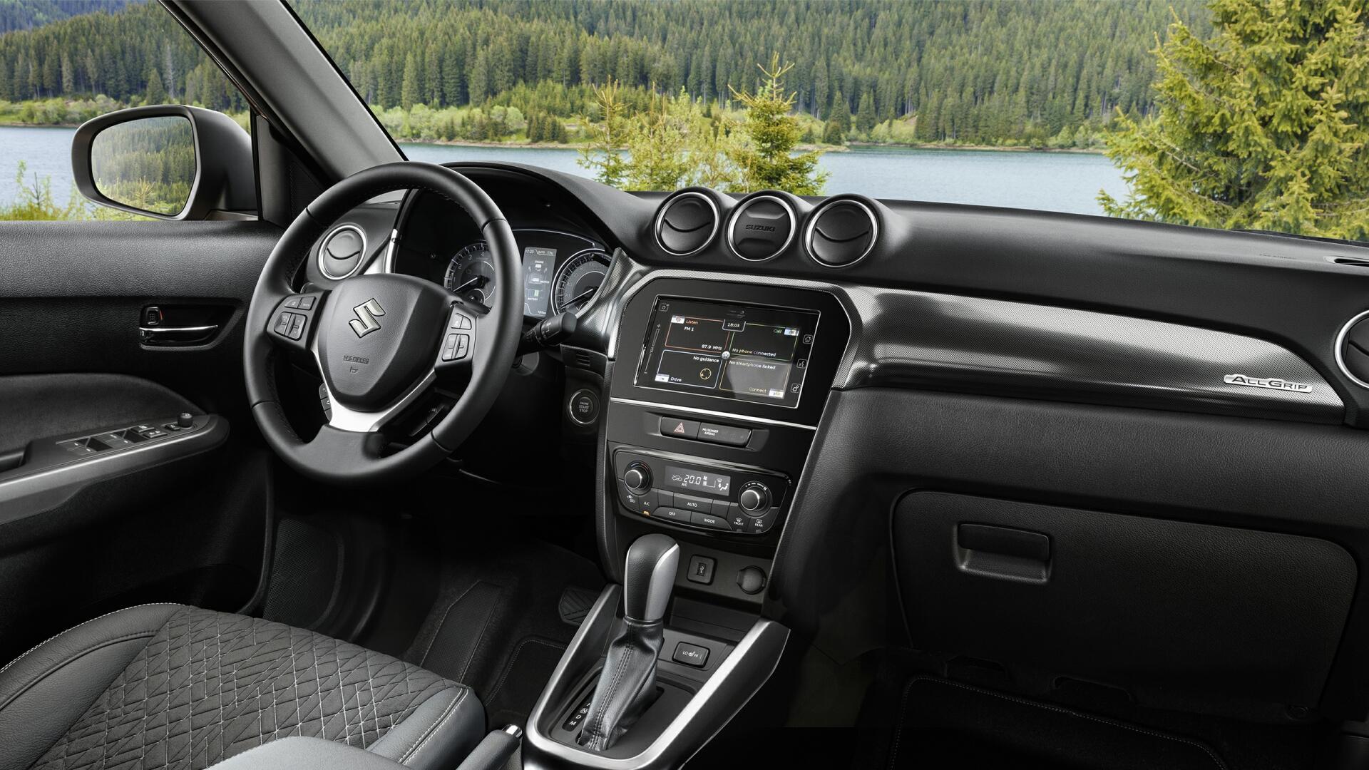 The Interior, Steering, Dashboard, And Central Console Of A 2024 Suzuki Vitara (Credits Suzuki)