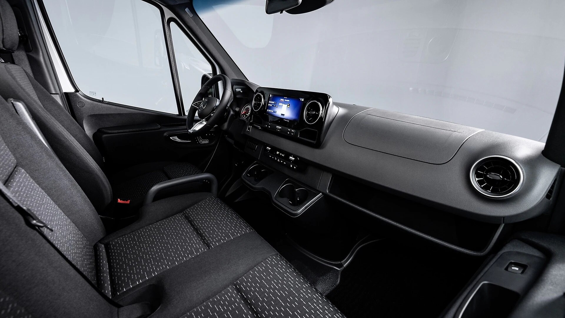 The Interior, Steering, Dashboard, And Central Console Of A 2025 Mercedes-Benz eSprinter (Credits Mercedes-Benz Group)