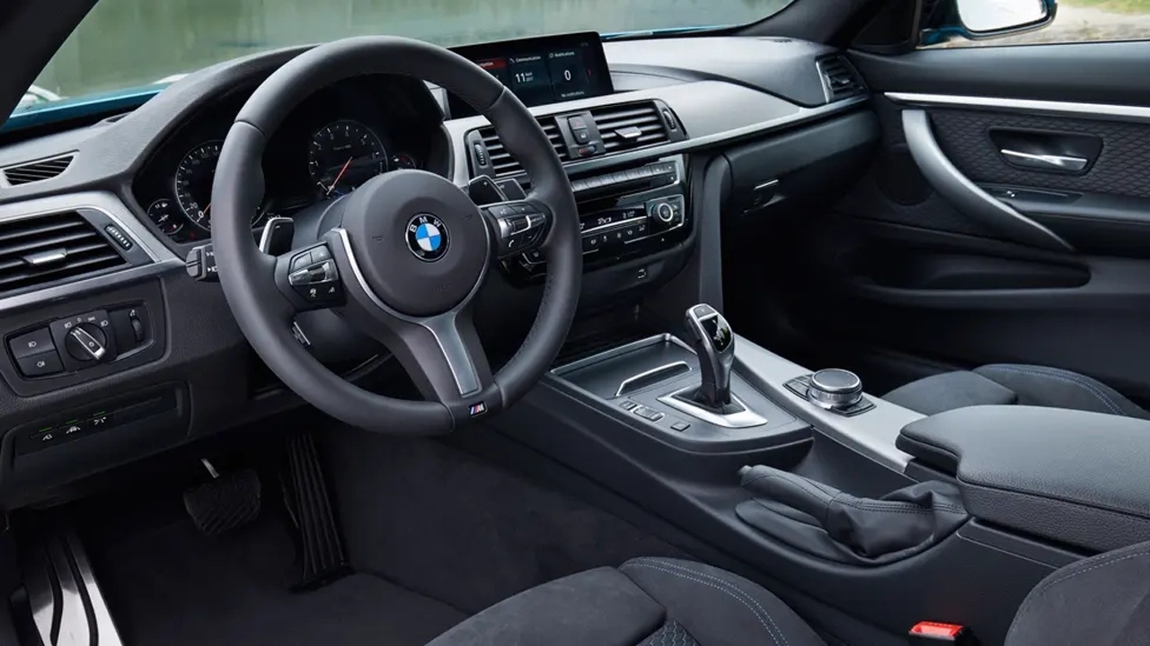 The Interior, Steering, Dashboard, And Central Console Of A BMW 4 Series (Credits TopGear)