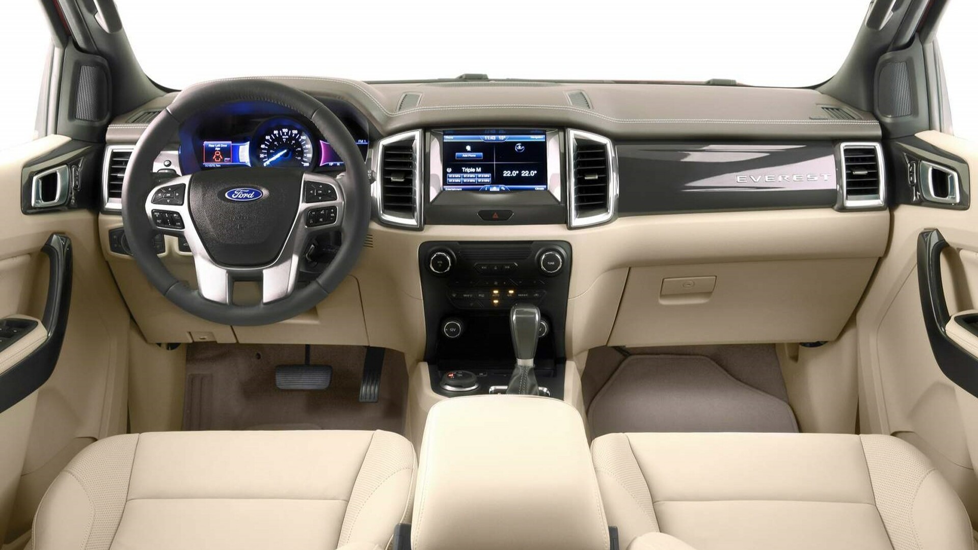 The Interior, Steering, Dashboard, And Central Console Of A Ford Everest