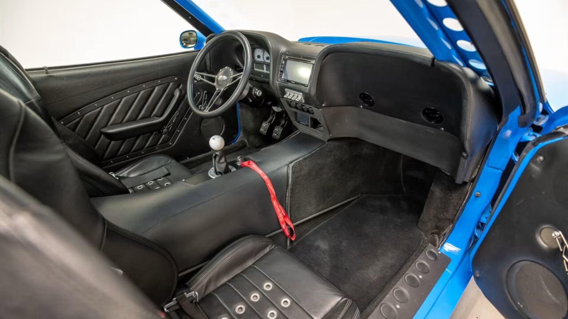 The Interior, Steering, Dashboard, And Central Console Of The 1978 Ford Mustang II 'Phoenix' (Credits Mecum Auctions)