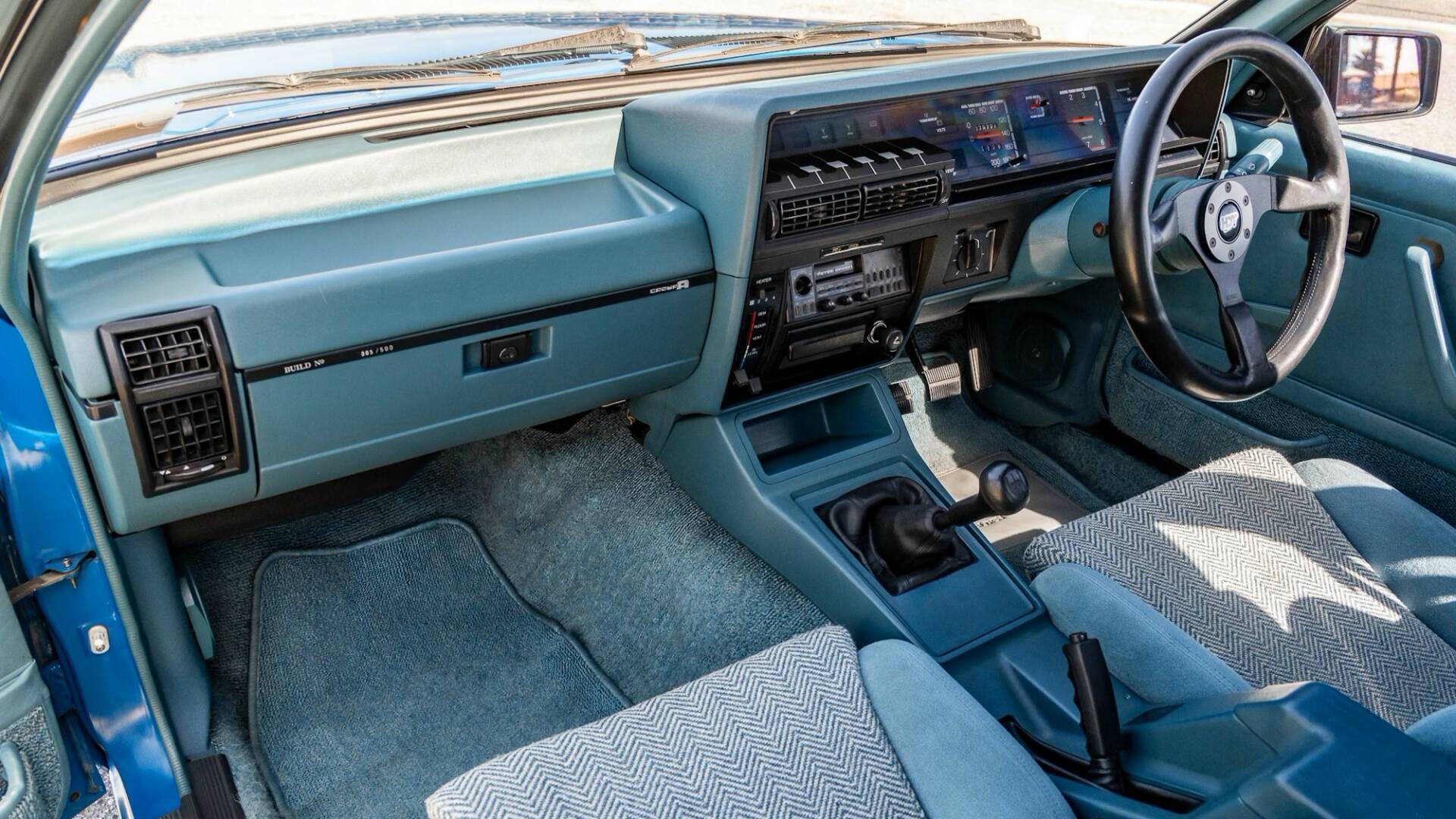 The Interior, Steering, Dashboard, And Central Console Of The Holden Commodore VK (Credits Collecting Cars)