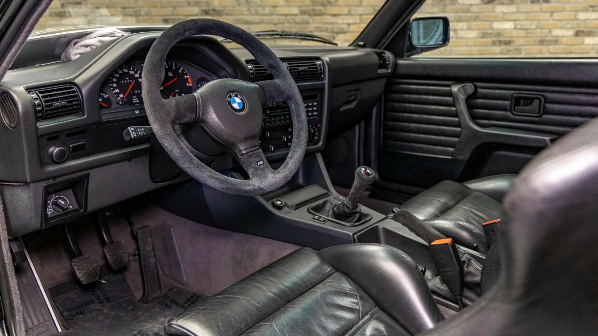 The Interior, Steering Wheel, And Dashboard Of A BMW M3 Sport Evolution (Credits Bring a Trailer)