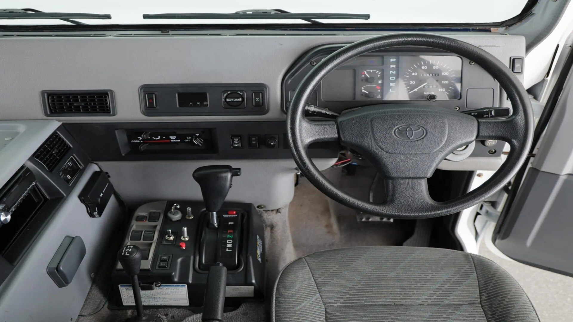 The Steering And Dashboard Of A Toyota Mega Cruiser (Credits Bring a Trailer)
