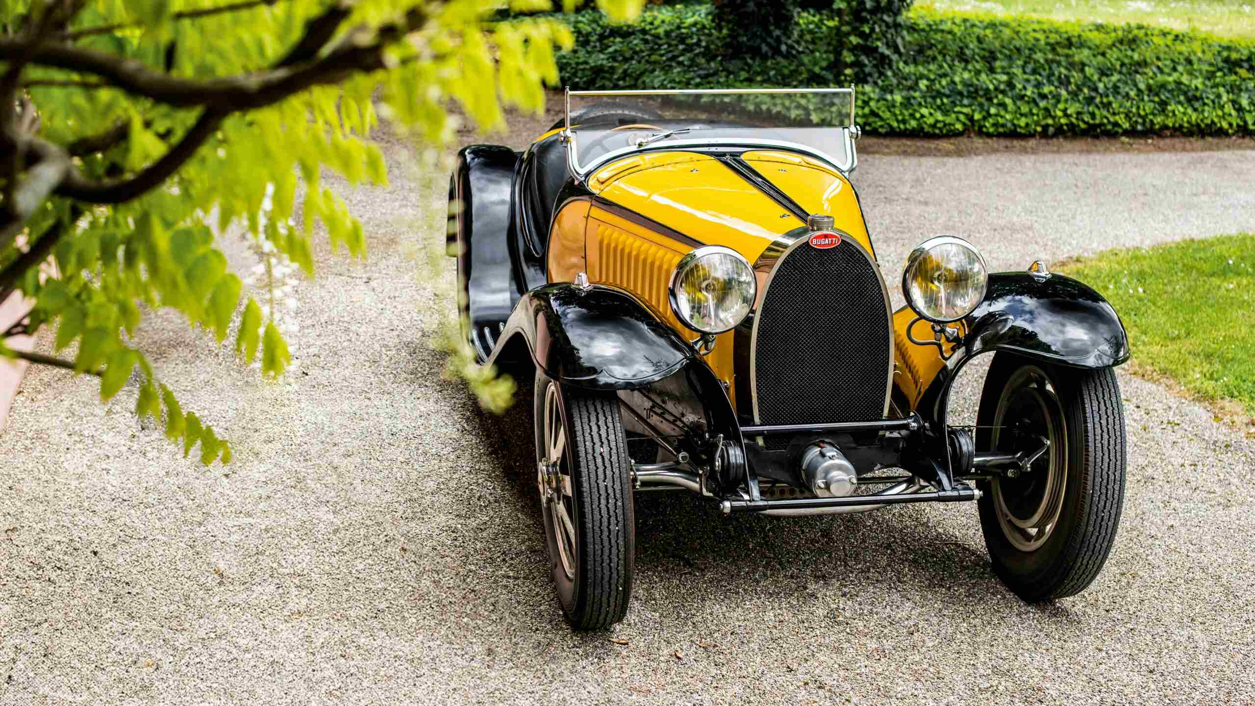 A Bugatti Type 55 Super Sport With A Black And Yellow Exterior Shade