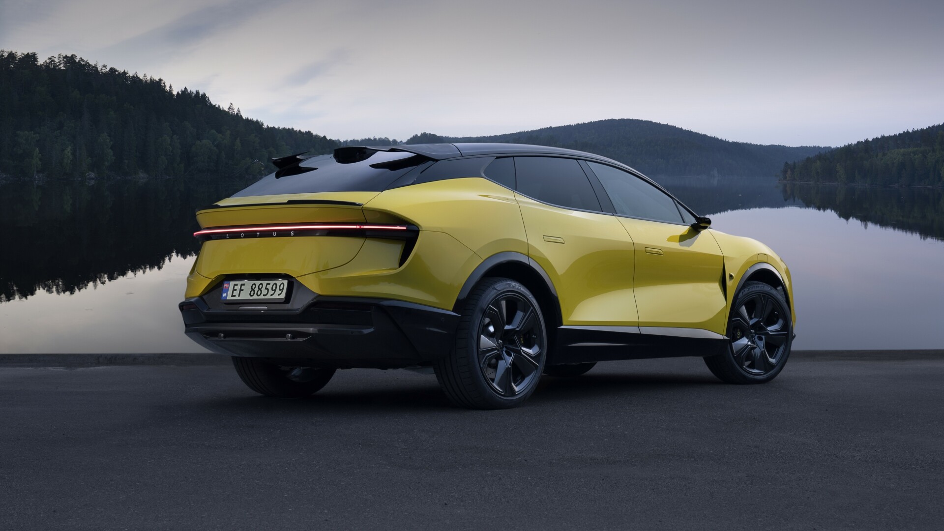 The Rear And Side Profiles Of A 2025 Lotus Eletre S - Exterior Shade Solar Yellow