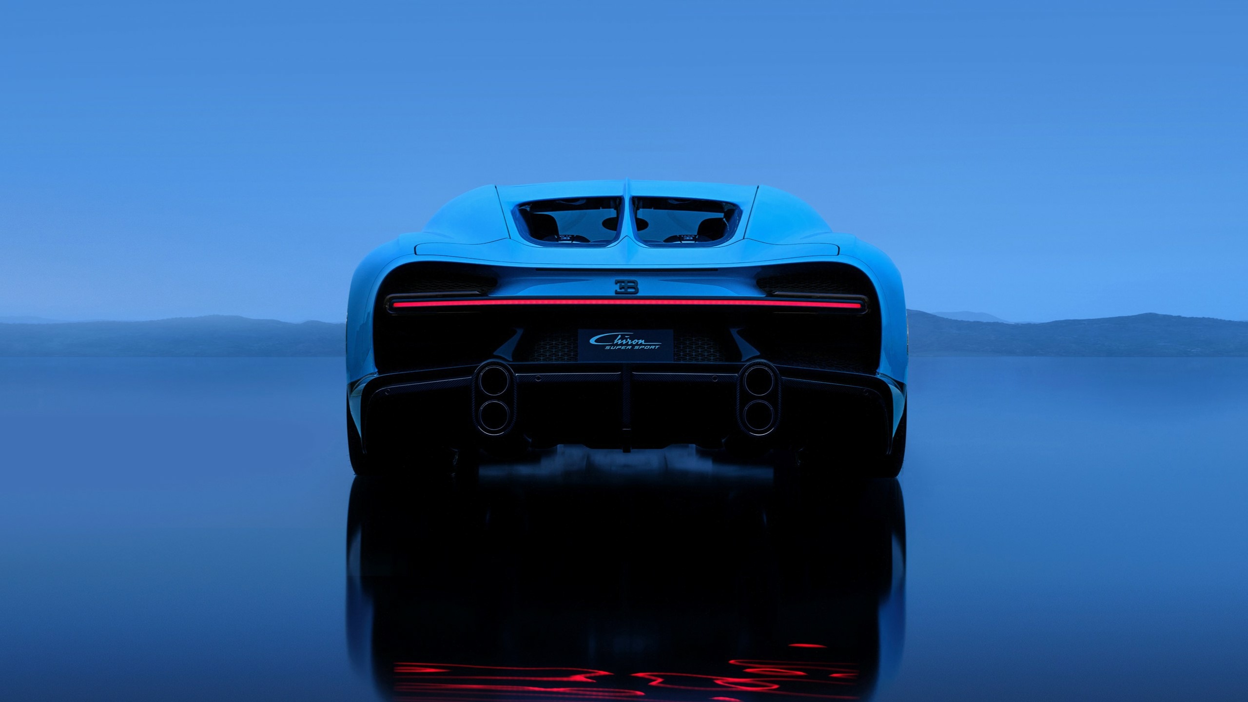 Rear View Of A Bugatti L’Ultime Super Sport In A Fade Of French Racing Blue And Atlantic Blue