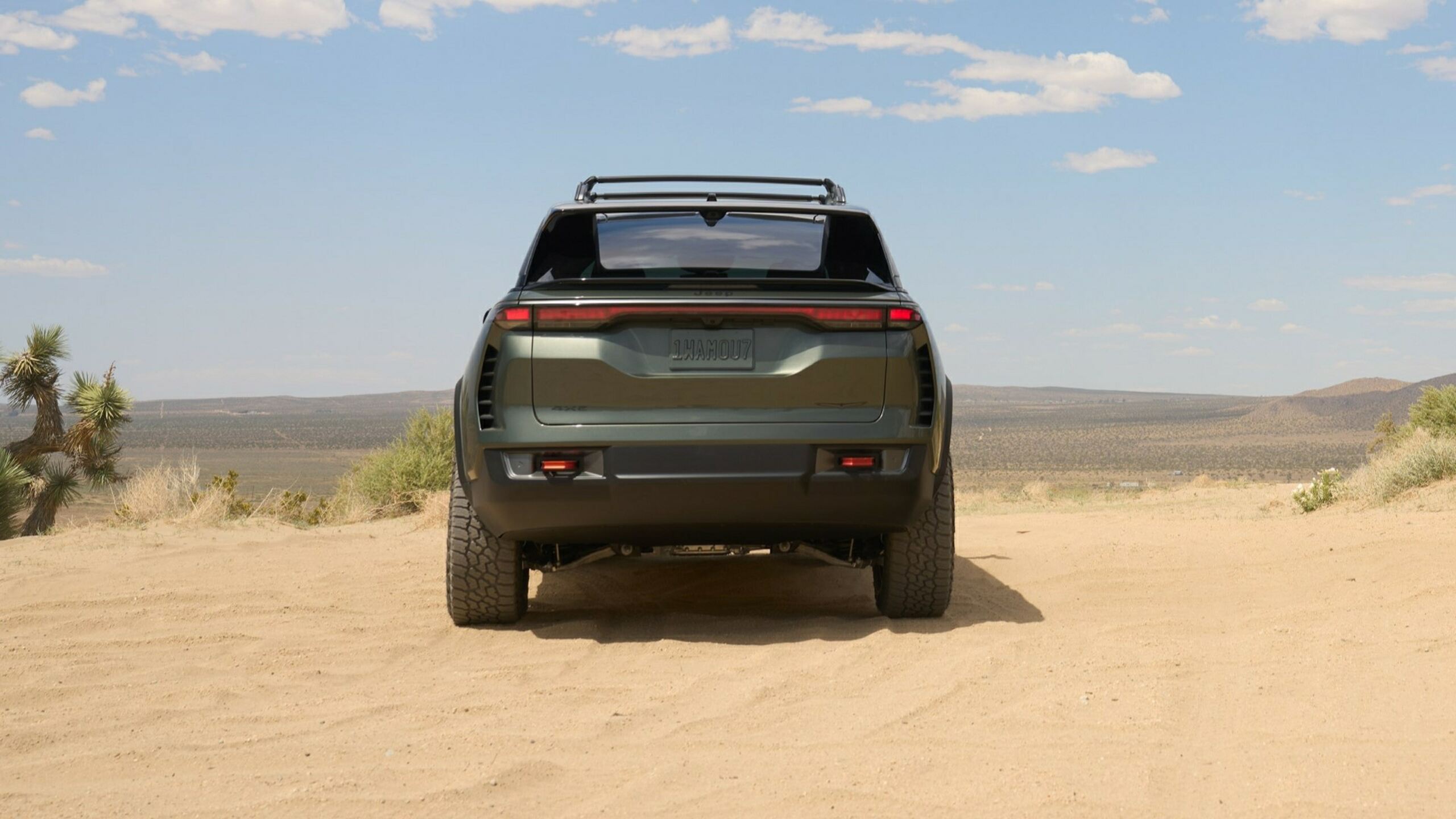 Rear View Of A Jeep Wagoneer S Trailhawk Concept In Special-Edition Banner Exterior Color