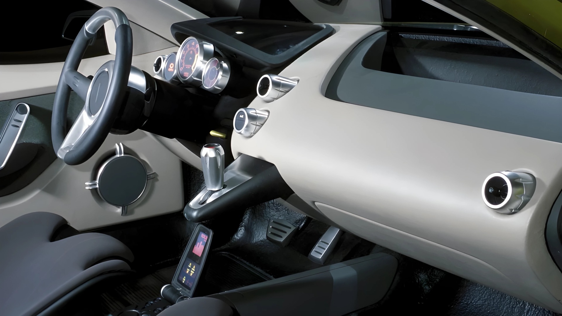 The Interior, Steering Wheel And Dashboard Of The 2001 Pontiac REV Concept Car