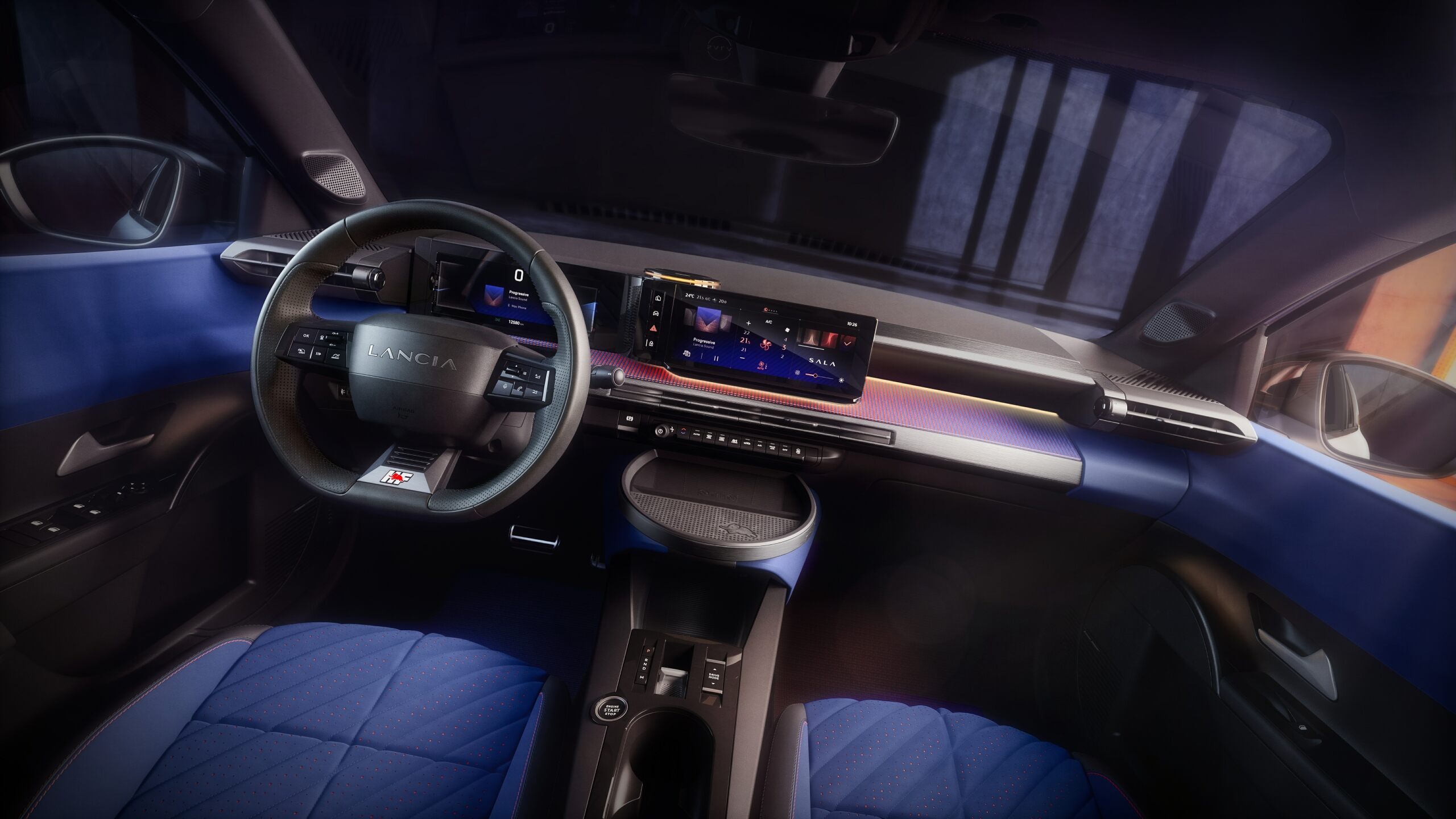 The Interior, Steering Wheel, Dashboard, And Center Console Of A Lancia Ypsilon HF (Lancia)