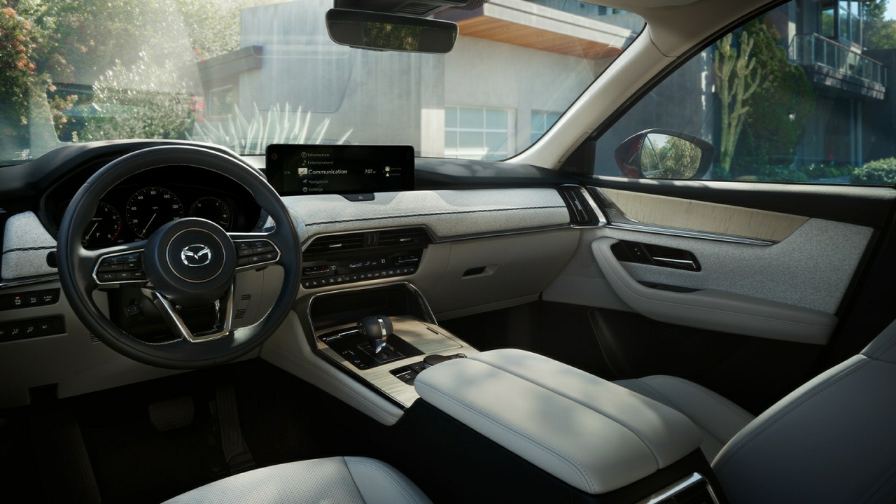The Interior, Steering Wheel, Dashboard, And Center Console Of A Mazda CX-90