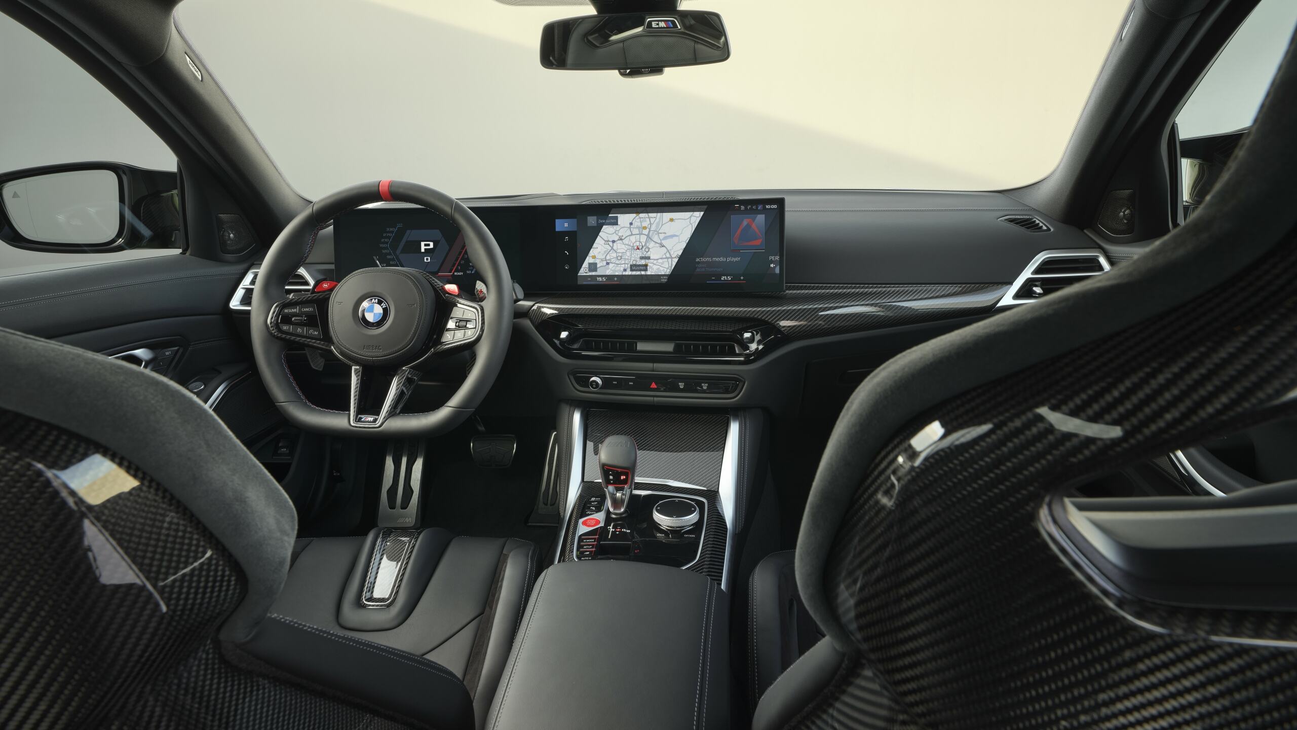 The Interior, Steering Wheel, Dashboard, And Center Console Of The New BMW M3