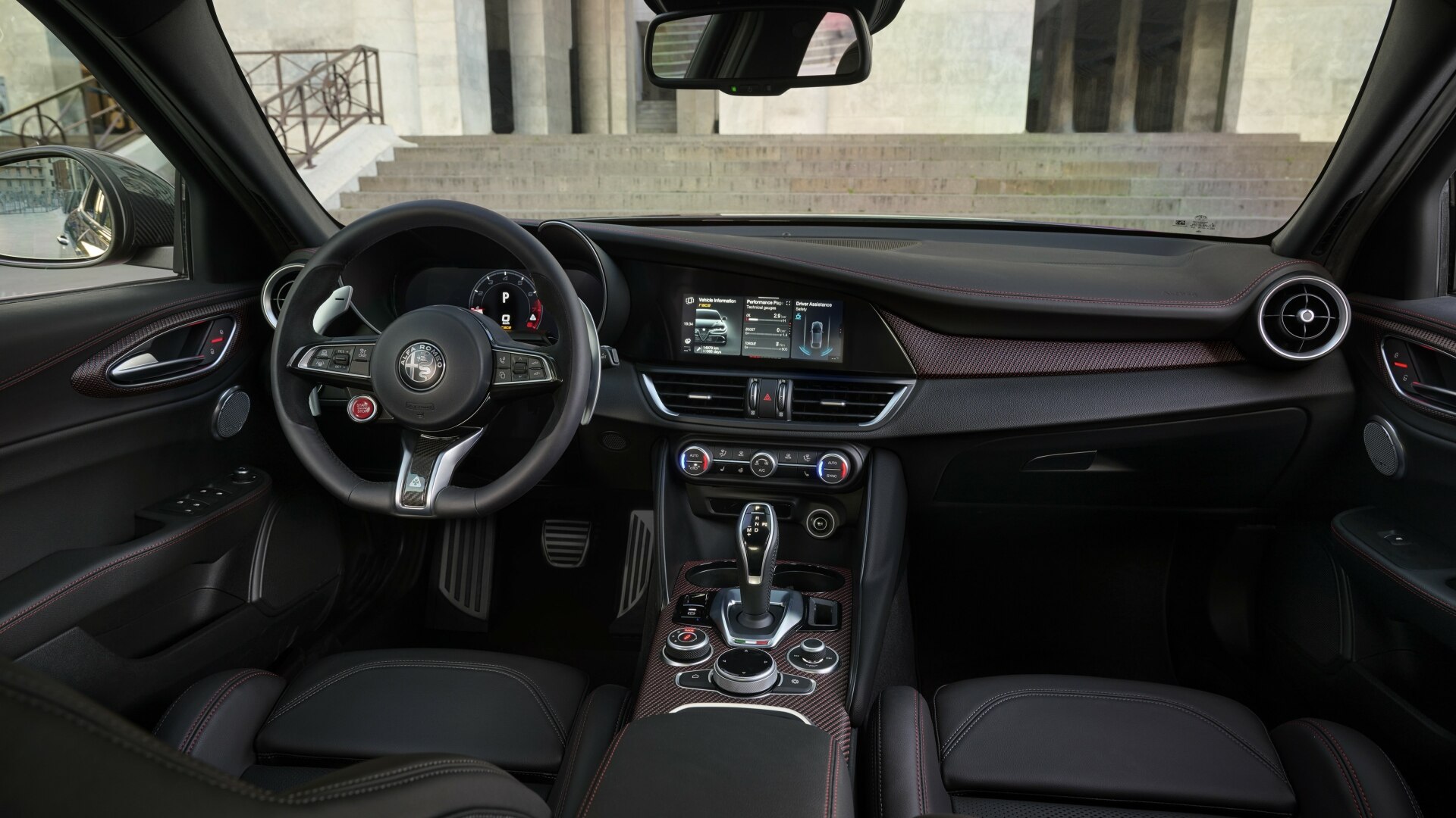 The Red Carbon Interior Accented Cockpit Of The Alfa Romeo Giulia Super Sport