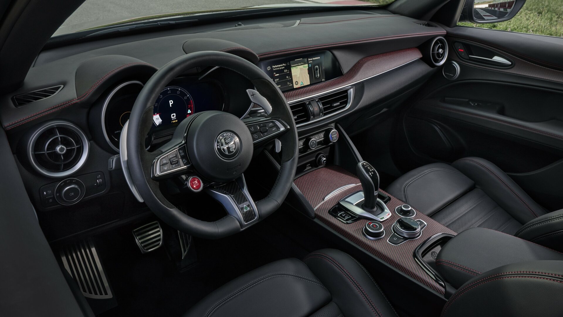 The Red Carbon Interior Accented Cockpit Of The Alfa Romeo Stelvio Super Sport
