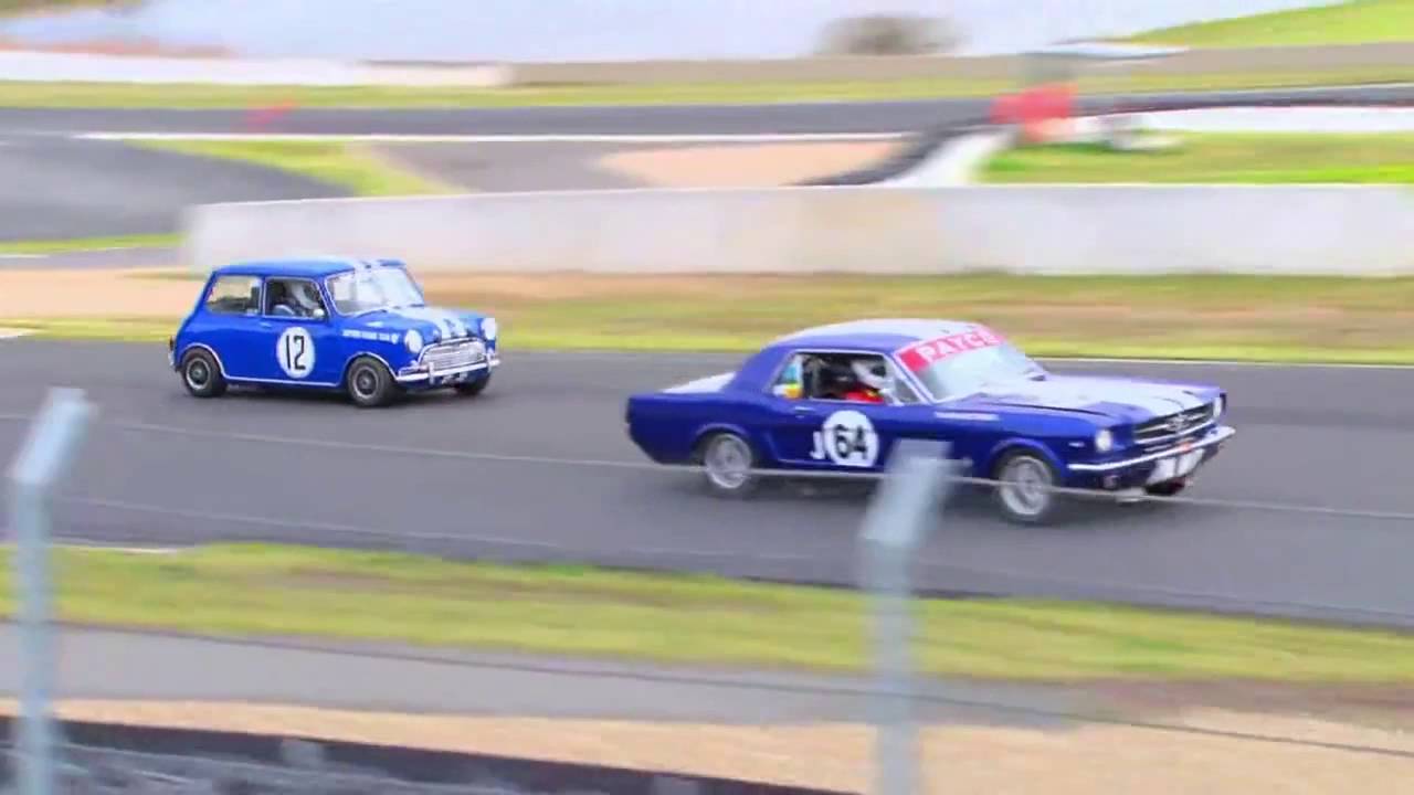Vintage Racing Spectacle: Minis Clash with Mustangs in Epic Showdown
