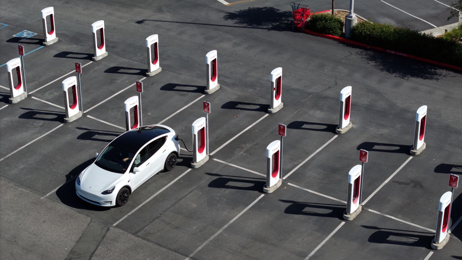 Biden's Highway Electrification Program at Risk Amid Tesla's EV Charging Team Layoffs