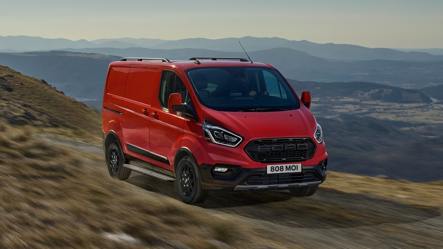 Front 3/4 View Of A Ford Transit Custom In Race Red (Ford)