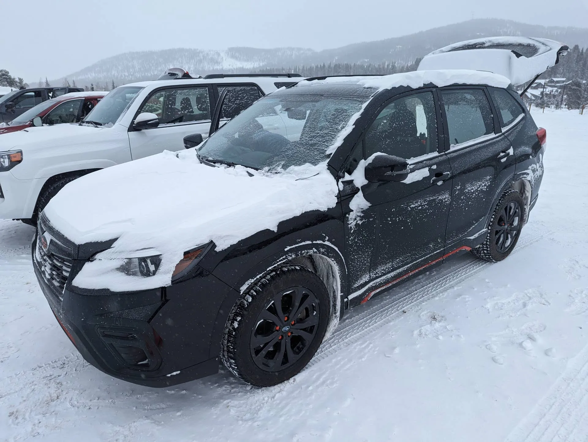 Vehicles on a snowy mountain