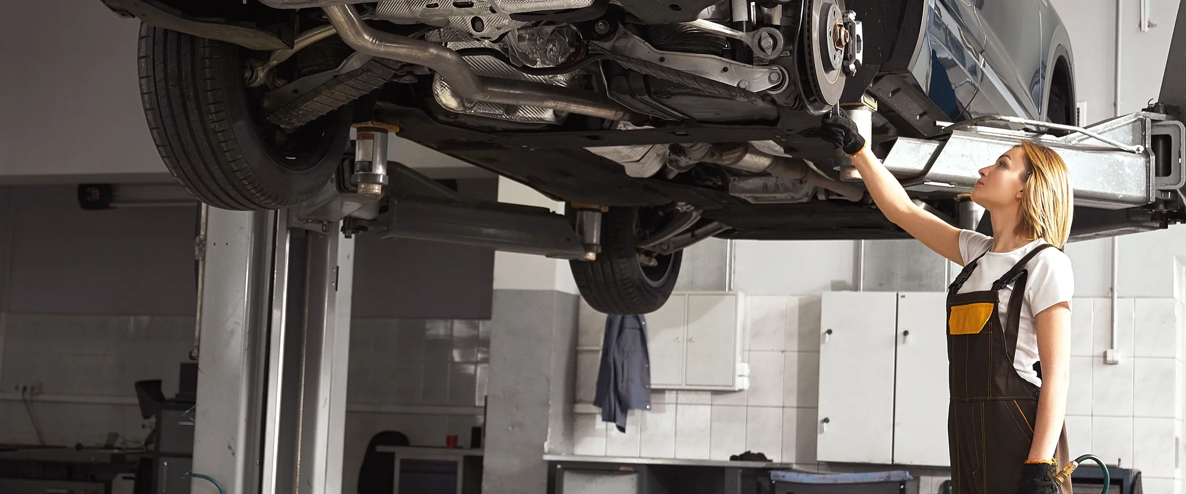 A car being serviced in a repair shop