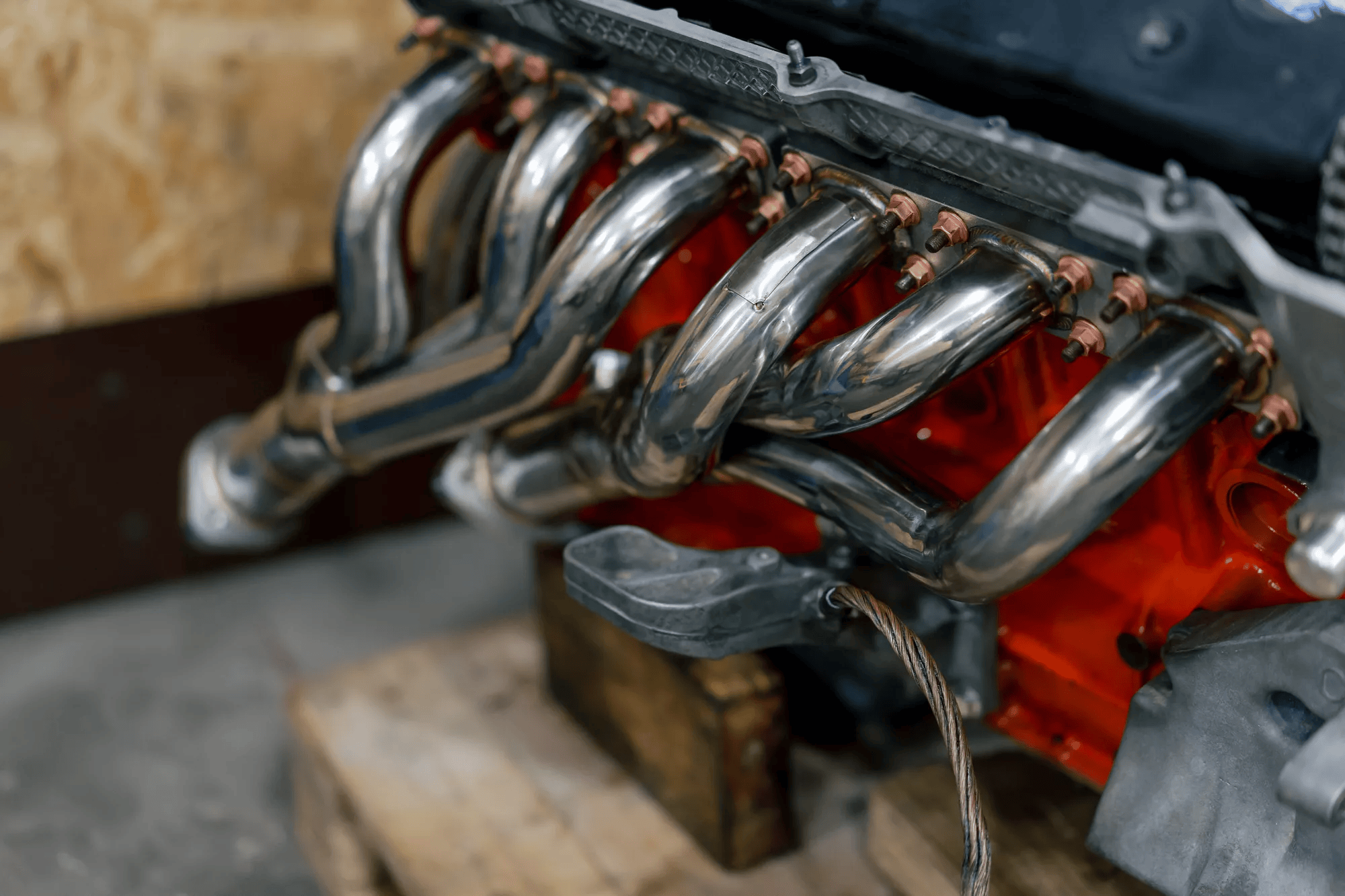 A car engine fitted with aftermarket exhaust headers