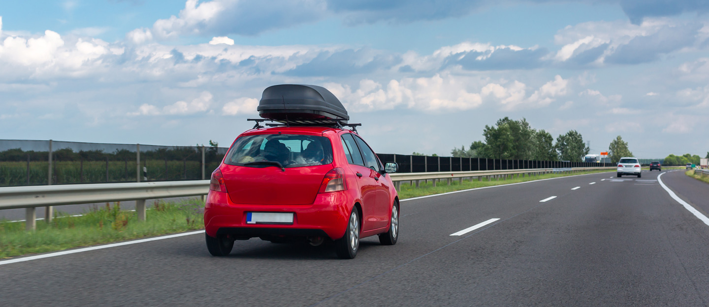 A red Toyota Vitz, also known as the Toyota Yaris A red Toyota Vitz, also known as the Toyota Yaris