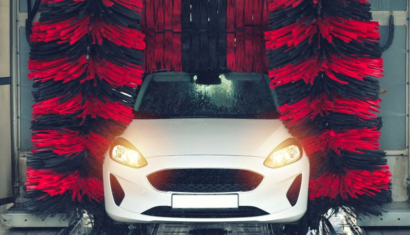 White car undergoing a wash