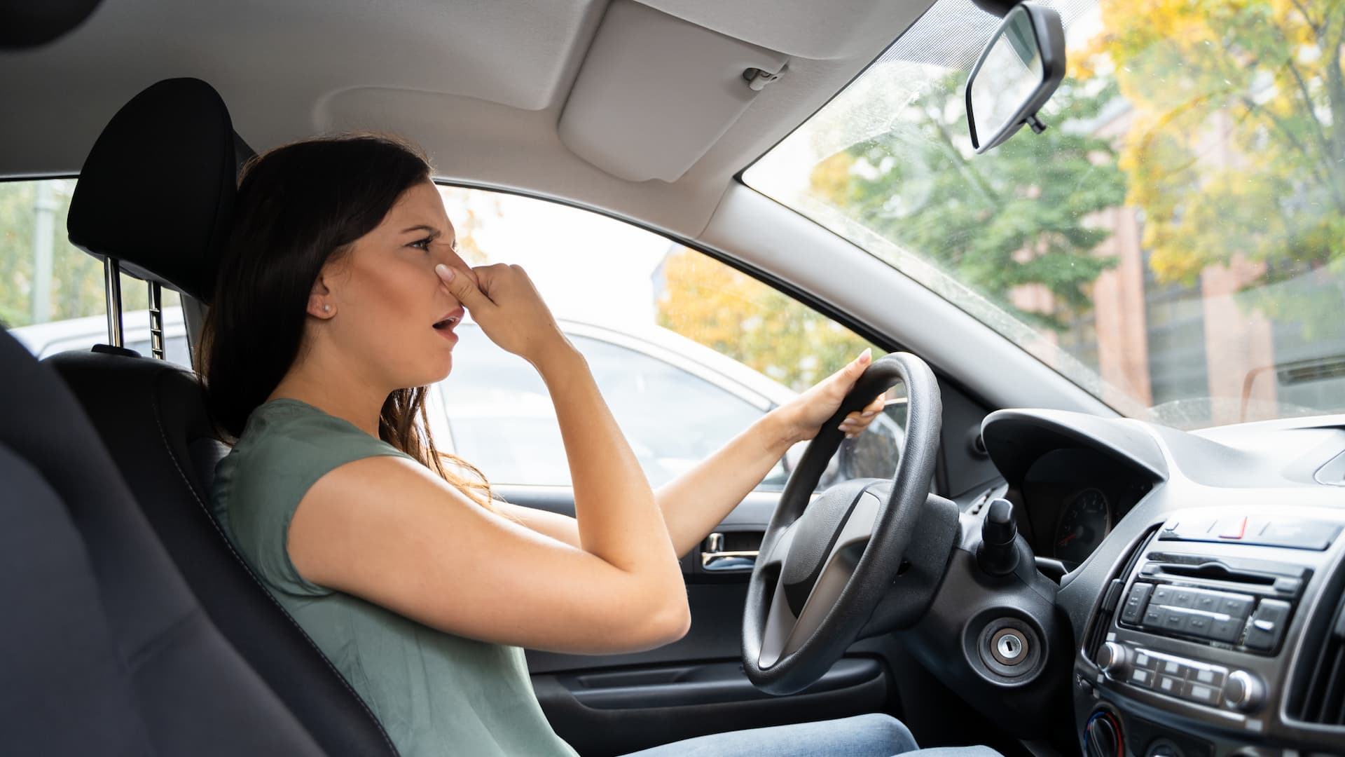 A driver experiencing a strong, unpleasant odor inside vehicle