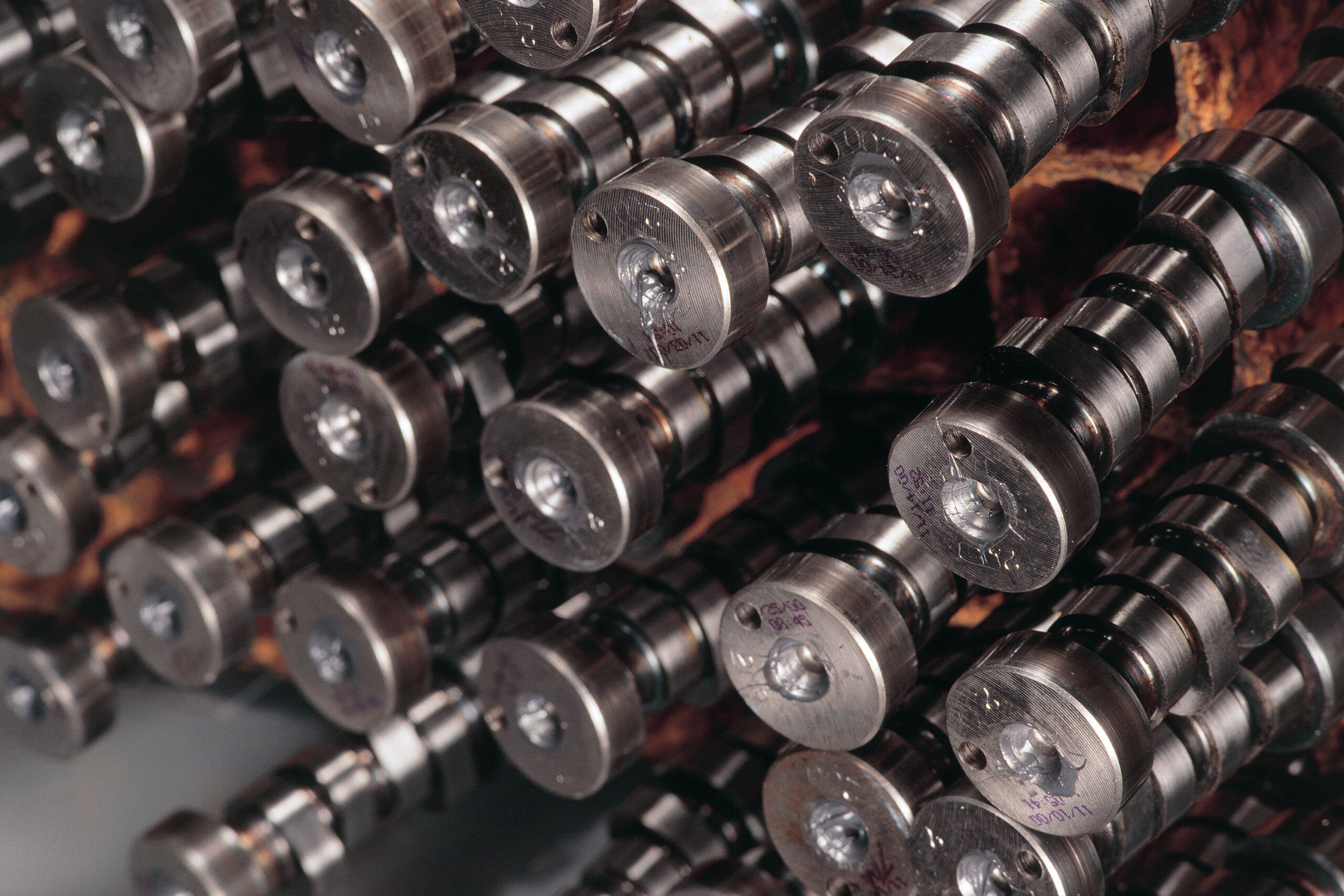 A rack of automotive camshafts A rack of automotive camshafts