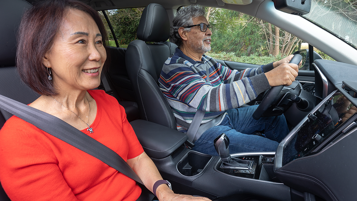 Adult couple driving in a car