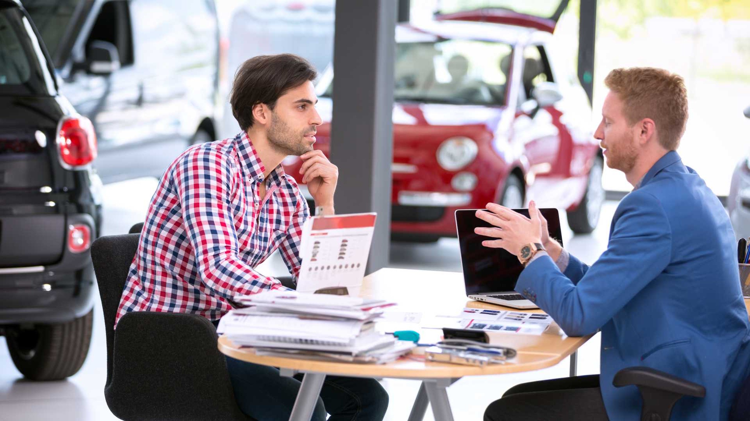 Negotiation during potential vehicle purchase at a car dealership