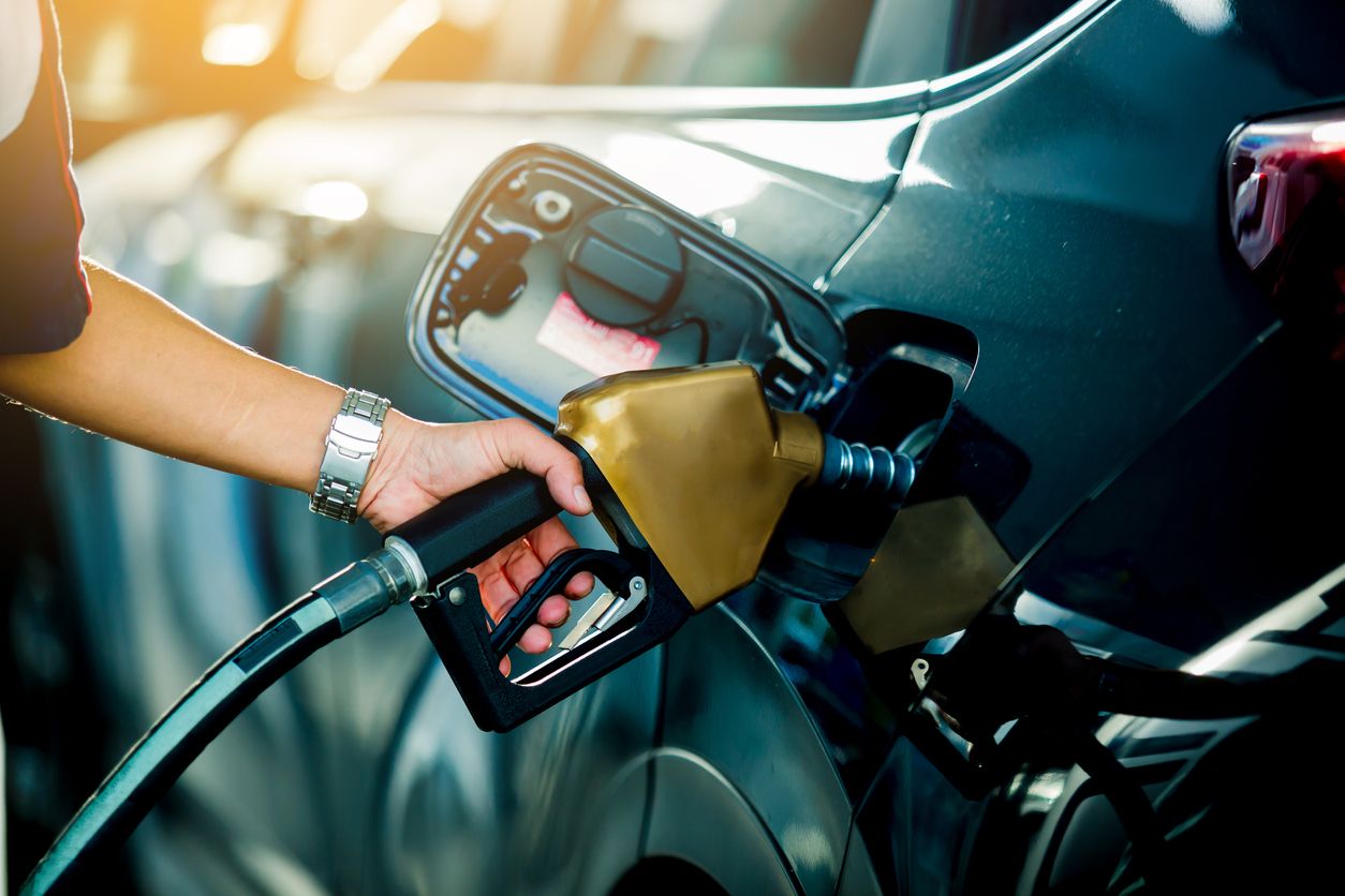 Refueling a vehicle at a gas station Refueling a vehicle at a gas station